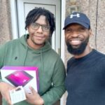 FIG 10 EAST LONDON Jamal welcoming his new LenovoM10 tablet device.